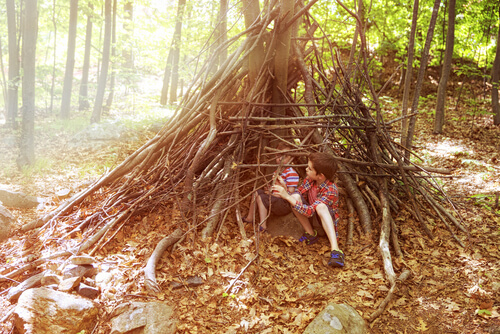 Children playing in a den